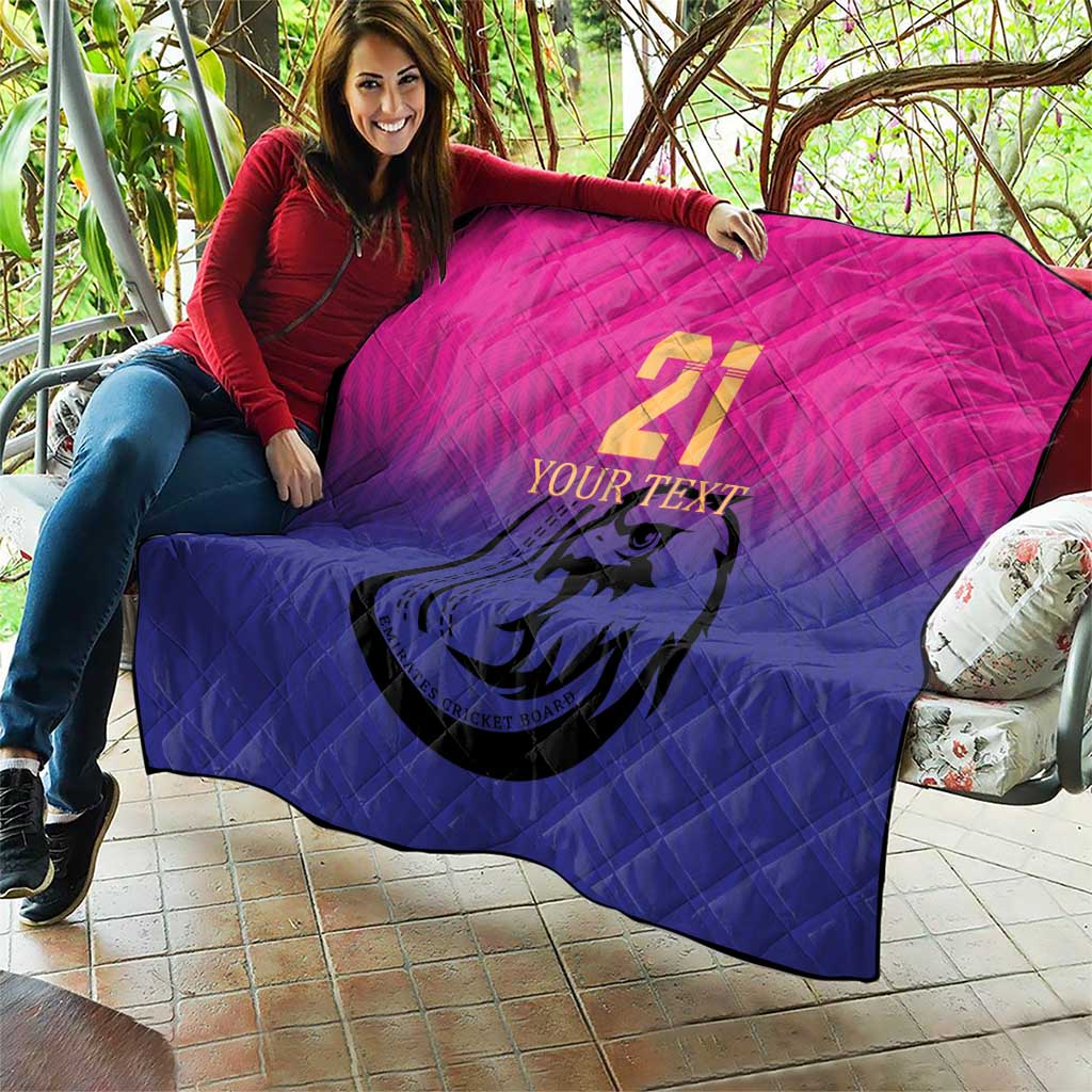 Custom cricket quilt draped outdoors, pink-to-blue gradient with number 21 and falcon emblem