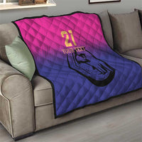 Custom cricket quilt on sofa, pink-to-blue quilted design with number 21 and falcon emblem