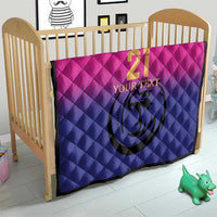 Custom cricket quilt in crib, pink-to-blue quilted pattern with number 21 and falcon logo