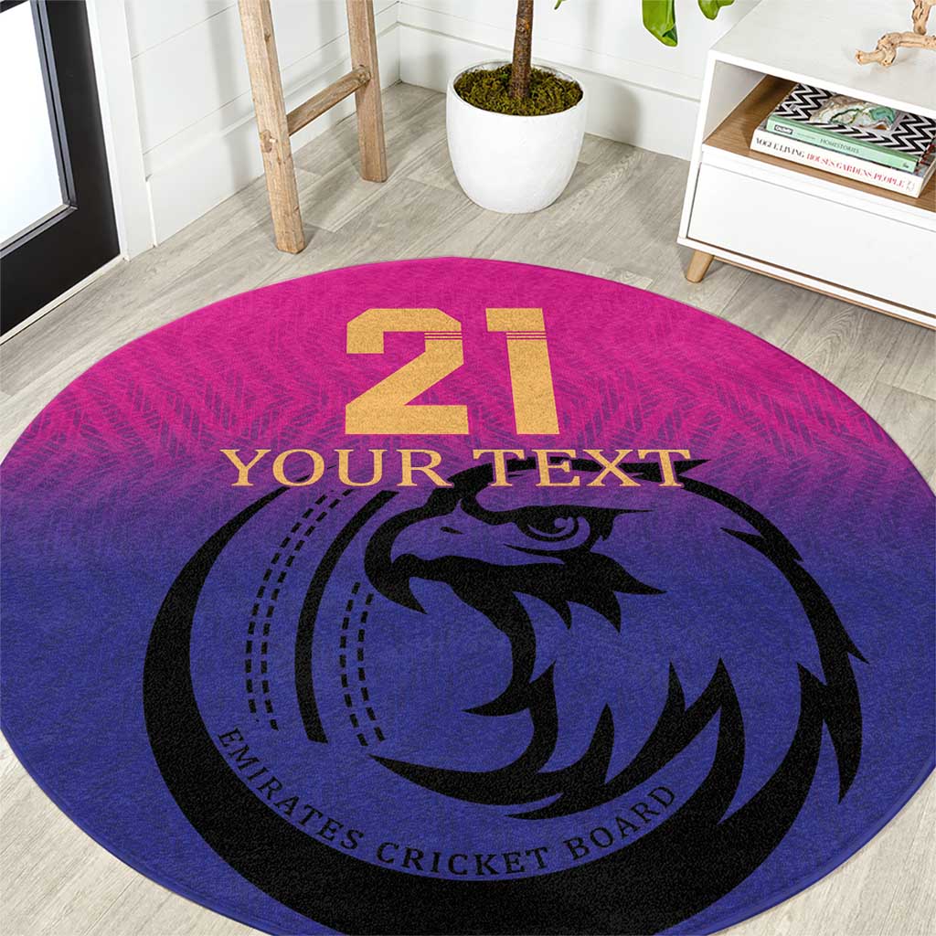 Pink round cricket carpet with blue falcon logo, gold 21, and 'YOUR TEXT'