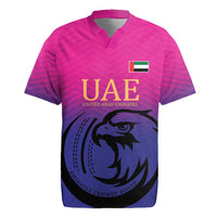 Pink cricket rugby jersey with UAE crest, falcon graphic, and flag patch on chest