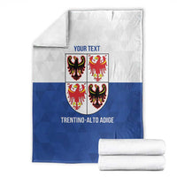 Personalized blue and white blanket with crest shield, 'Your Text', and rolled white towels
