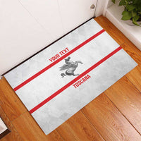 Personalized white doormat with red border stripes, pegasus emblem, “YOUR TEXT” and “TOSCANA”