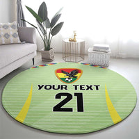 Round green rug with eagle soccer badge and 'YOUR TEXT 21' numerals, yellow edge trim