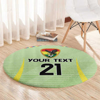 Green circular carpet with 'YOUR TEXT 21' print and eagle soccer emblem in center