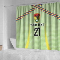 Green shower curtain with crest, multicolor diagonal stripes, 'YOUR TEXT' and '21' text