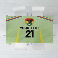 Green soccer tablecloth with Wiphala-style flag pattern and custom number print in center
