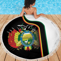 Round beach blanket with country crest graphic, white fringed border and black printed center