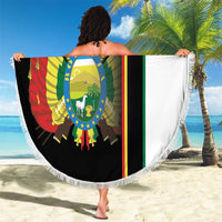 Round beach blanket displaying country crest with flag stripes, white fringe edge and white side