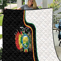 Quilt blanket with black-and-white panels and Bolivia coat of arms center graphic.