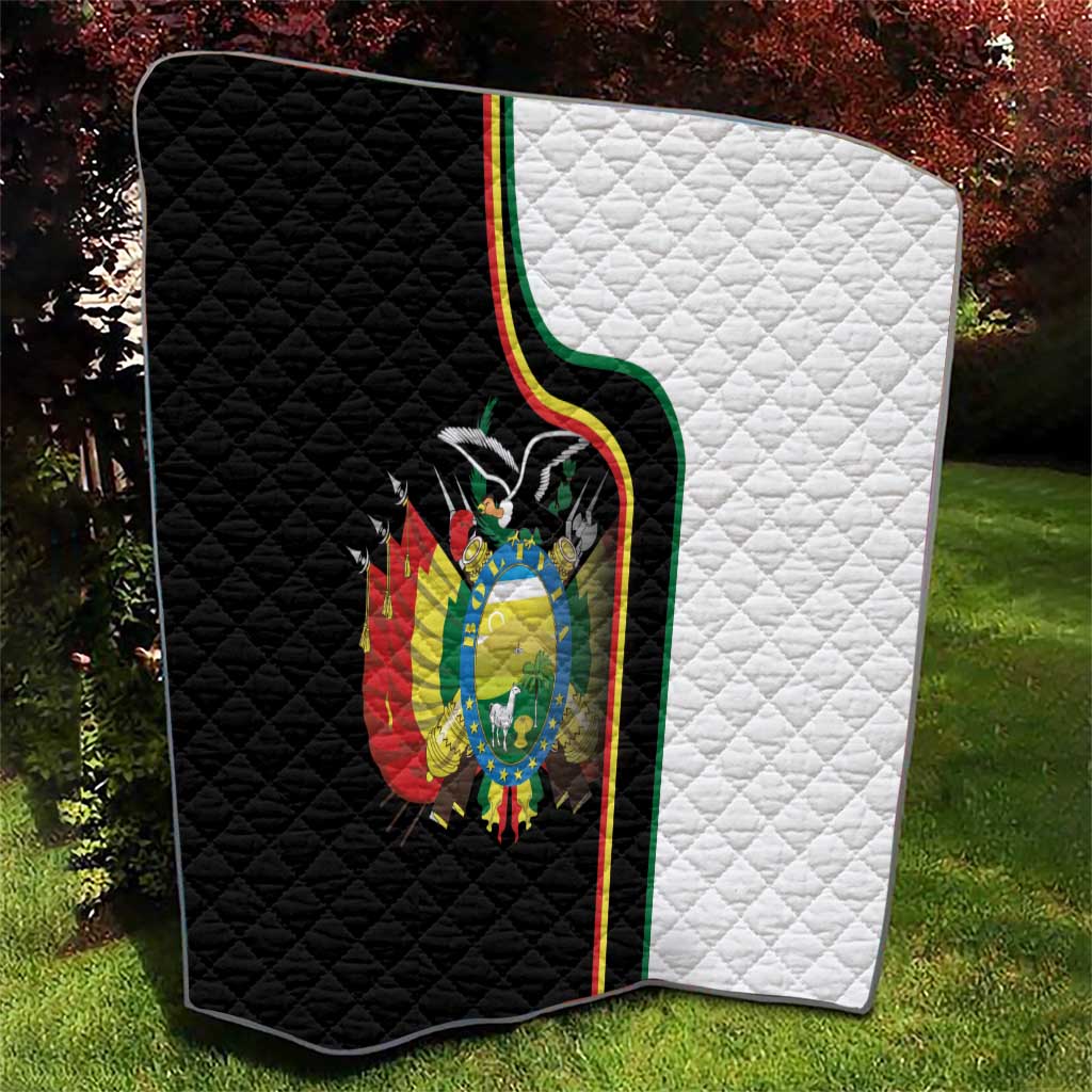 Black-and-white quilt with stitched diamond pattern and Bolivia coat of arms emblem.