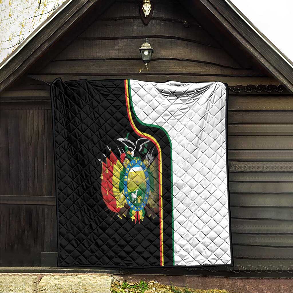 Quilt blanket with quilted texture, black-and-white halves, and Bolivia coat of arms.