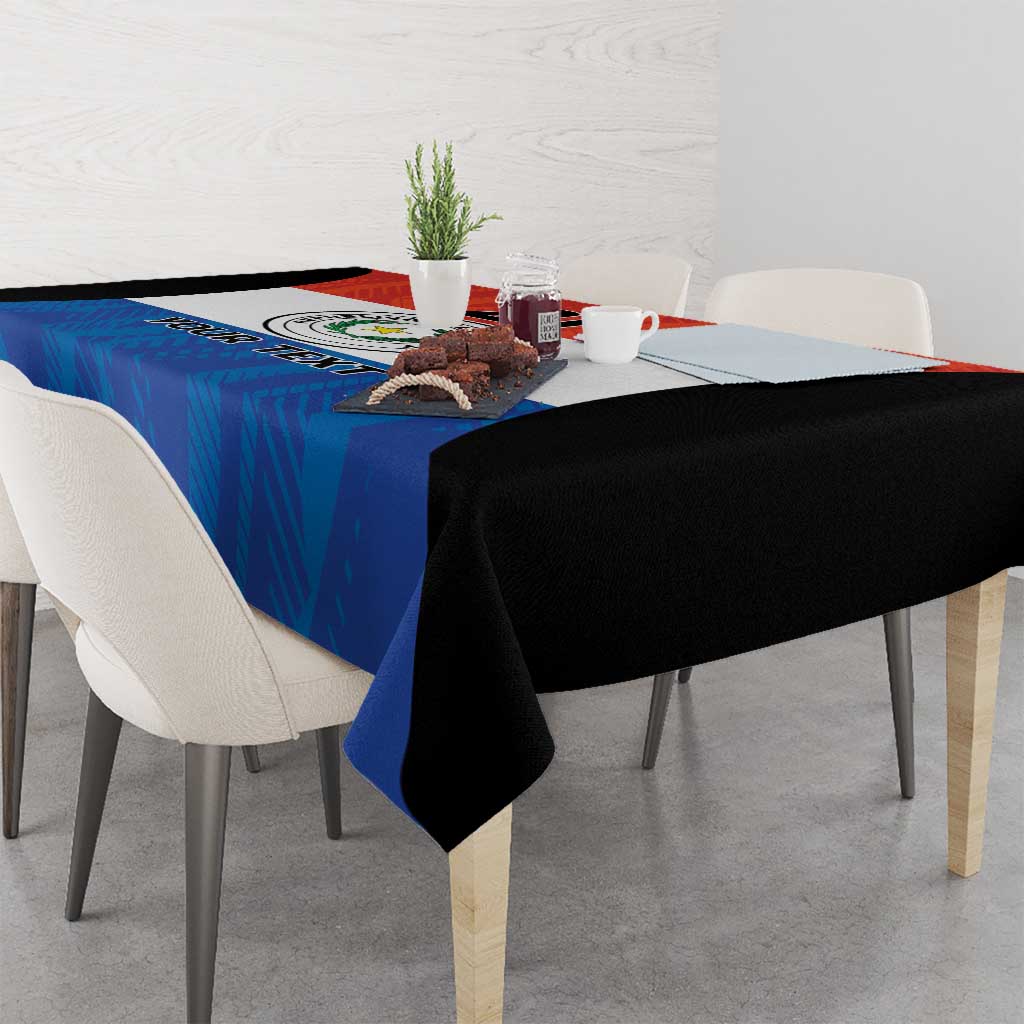 Paraguay flag style tablecloth draped over table edge, blue center with black corners