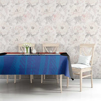 Paraguay flag style tablecloth on dining table, blue center with red band and black tips