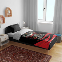 Black bedding set with eagle crest and red stripes on bed
