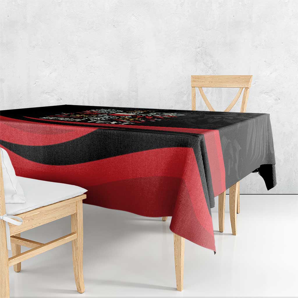 Black and red tablecloth with diagonal stripe pattern and eagle border detail