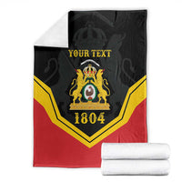 Black/red/yellow personalized throw blanket with crest and “YOUR TEXT”, 1804, folded