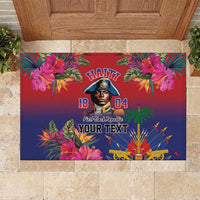 Floral rubber doormat with Haitian text and portrait graphic