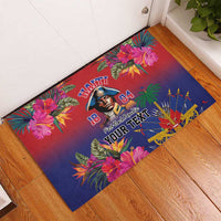 Tropical floral rubber doormat with portrait and bold Haitian lettering