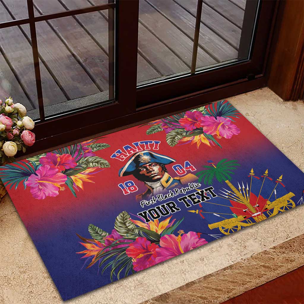 Floral rubber doormat on entry step with portrait, Haitian lettering, and fan design