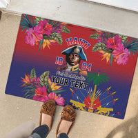 Red and navy floral rubber doormat with portrait, Haitian lettering, and fan pattern