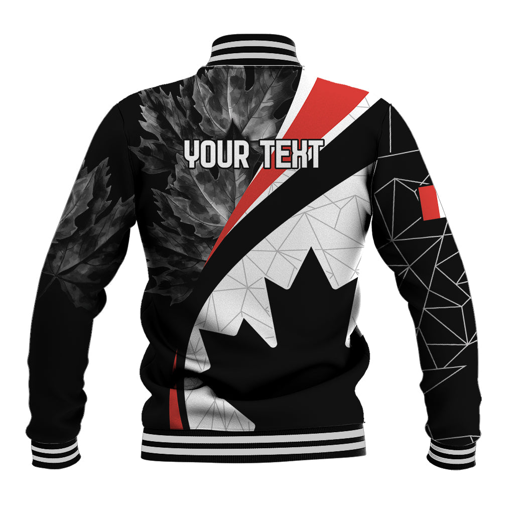 Black baseball jacket with white geometric panels, red diagonal stripe, and maple leaf graphic