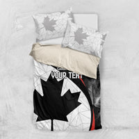 Top view Canada Day bedding set with maple leaf graphic and two folded pillowcases