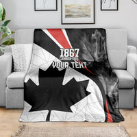 Canada Day personalized blanket laid on sofa: black and white maple leaf with “YOUR TEXT”