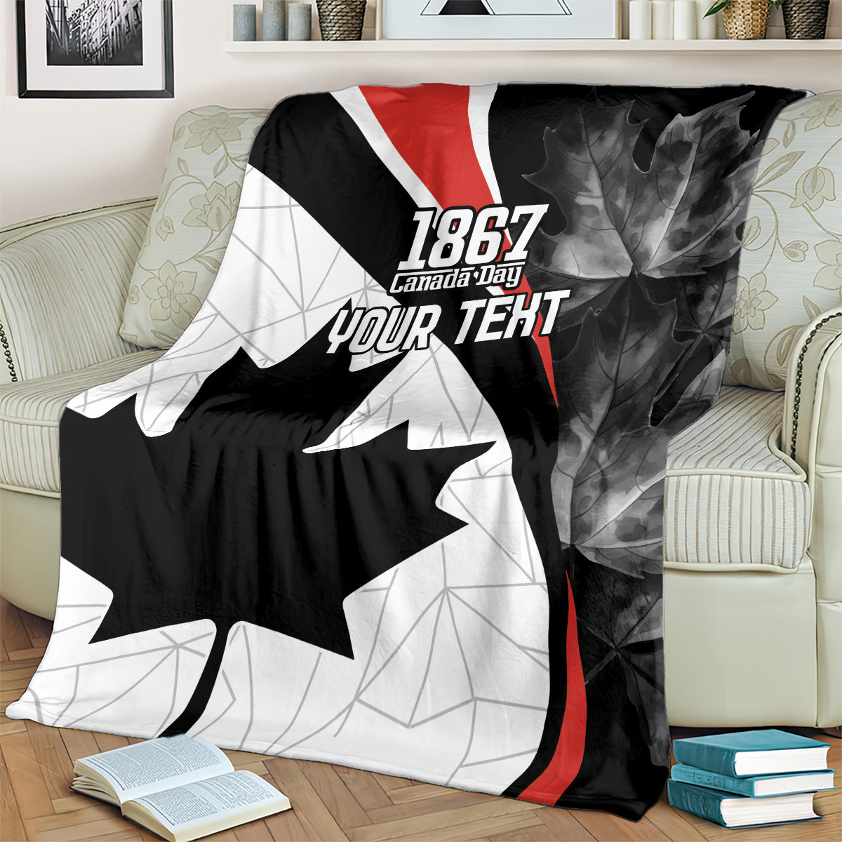 Personalized Canada Day blanket draped on a couch with 1867 and custom “YOUR TEXT”