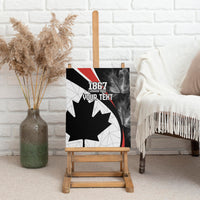 Framed black canvas wall art on display with maple leaf and 1867 Canada Day design