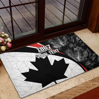 Canada-themed rubber doormat with black maple leaf, dark leaf pattern side, red stripe