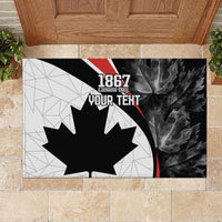 Canada Day rubber doormat with black maple leaf, gray geometric left, dark leaf right