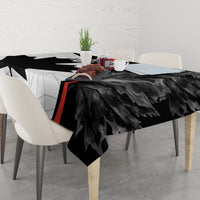 Black Canada Day tablecloth with maple leaf design and red stripe on dining table