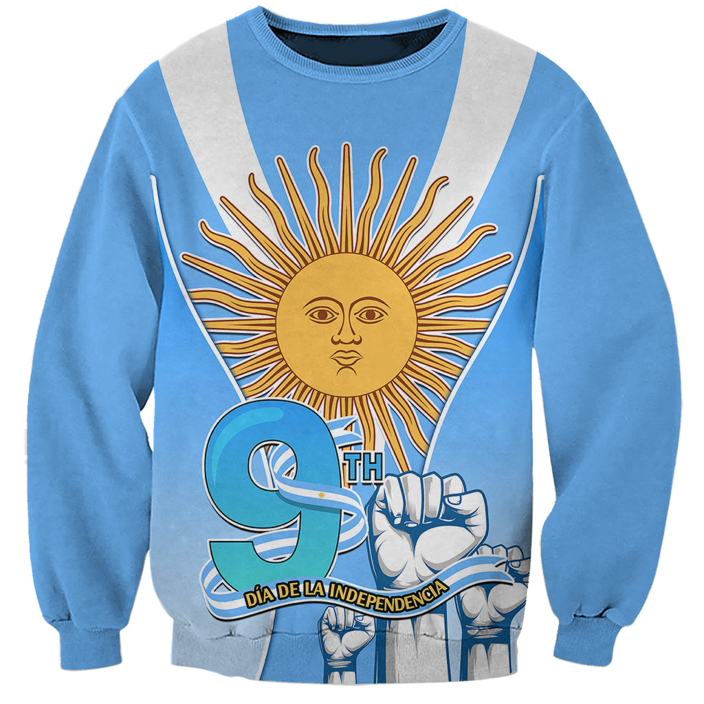 Blue unisex sweatshirt with sun and fist graphic, 'DIA DE LA INDEPENDENCIA'