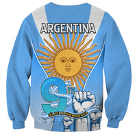 Blue unisex sweatshirt with 'ARGENTINA' and sun-fist design, 'DIA DE LA INDEPENDENCIA'