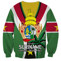 Green crewneck sweatshirt with Suriname crest, star, and 'SURINAME' text on front