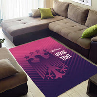 Purple area rug with pink graphic line, German text and bird silhouettes on living room floor