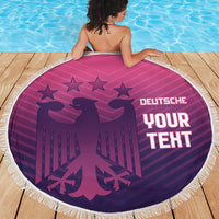 Round pink beach blanket with white fringe featuring Germany crest, stars, and “YOUR TEXT”