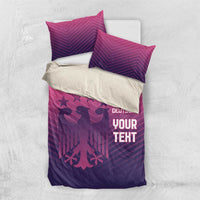 Pink and purple football bedding set with 'YOUR TEXT' and 'DEUTSCHE' on quilt