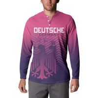 Pink quarter-zip button sweatshirt with DEUTSCHE GERMANY front graphic on model