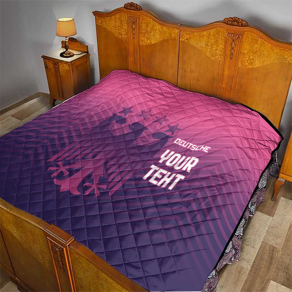 Pink and dark blue quilted blanket with diamond pattern and glowing 'YOUR TEHT' text on bed