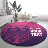 Round area rug with purple-pink football design, stars above eagle, centered text