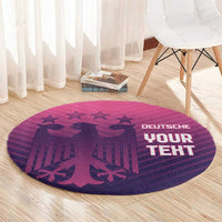 Round area rug with purple-pink striped football print and star-and-eagle motif