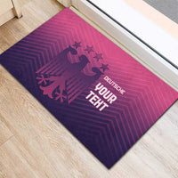 Dark purple rubber doormat with pink geometric pattern and eagle logo, YOUR TEXT