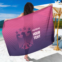 Pink and purple football-themed sarong with bold printed graphic and text