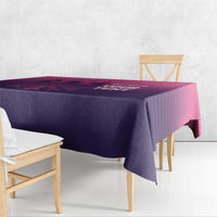 Football tablecloth draped over dining table with pink line graphic on purple