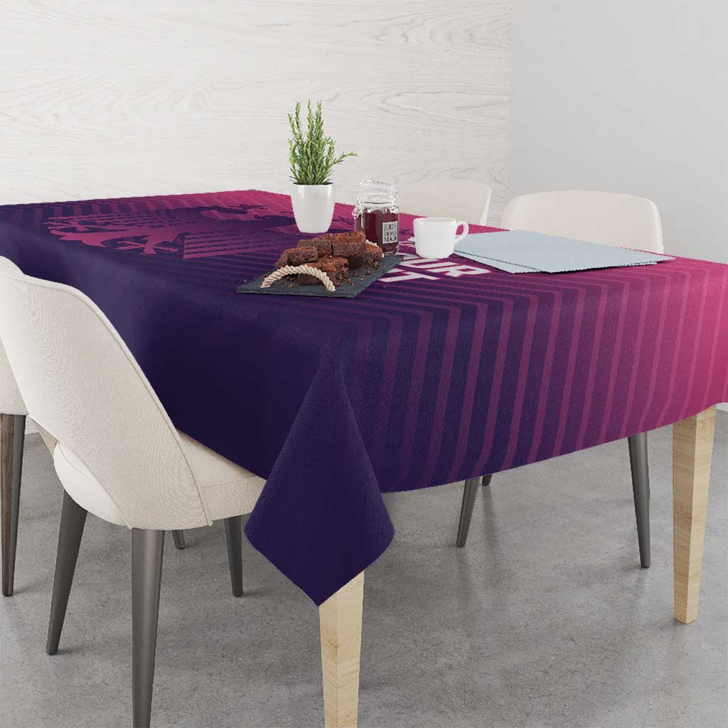 Football tablecloth with pink stripe pattern and printed emblem, draped on dining table