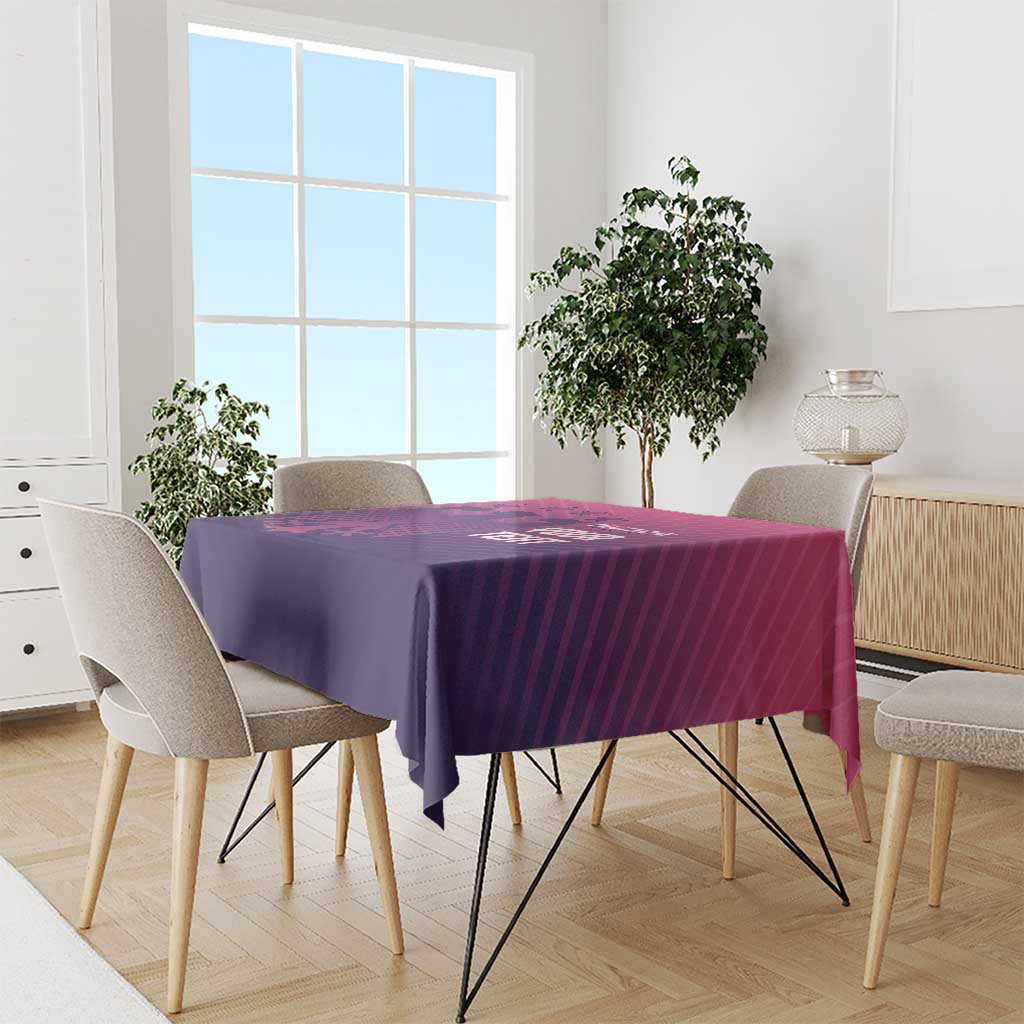Pink and purple football-themed tablecloth on dining table with neat draped corners
