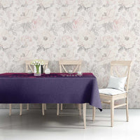 Purple football tablecloth with pink graphic lines, styled on a dining table