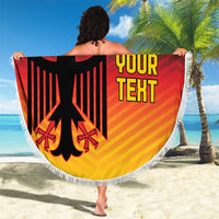 Round Germany flag beach blanket held outdoors, black red gold eagle emblem with white fringe